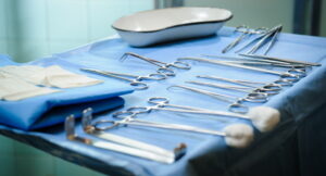 close up shot of sterile surgical tools laid out on surface ready for use