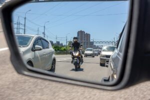 biker splitting lane