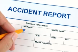 filling an accident report with a pencil