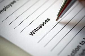 Pen and paper signaling the title "witnesses"