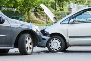 head-on accident between 2 cars on the road