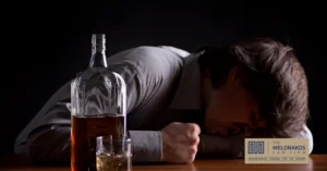 A bartender pouring drinks at a Greenville bar, representing dram shop liability for overserving alcohol